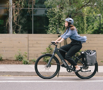 A woman commuting by Vvolt electric bike. 