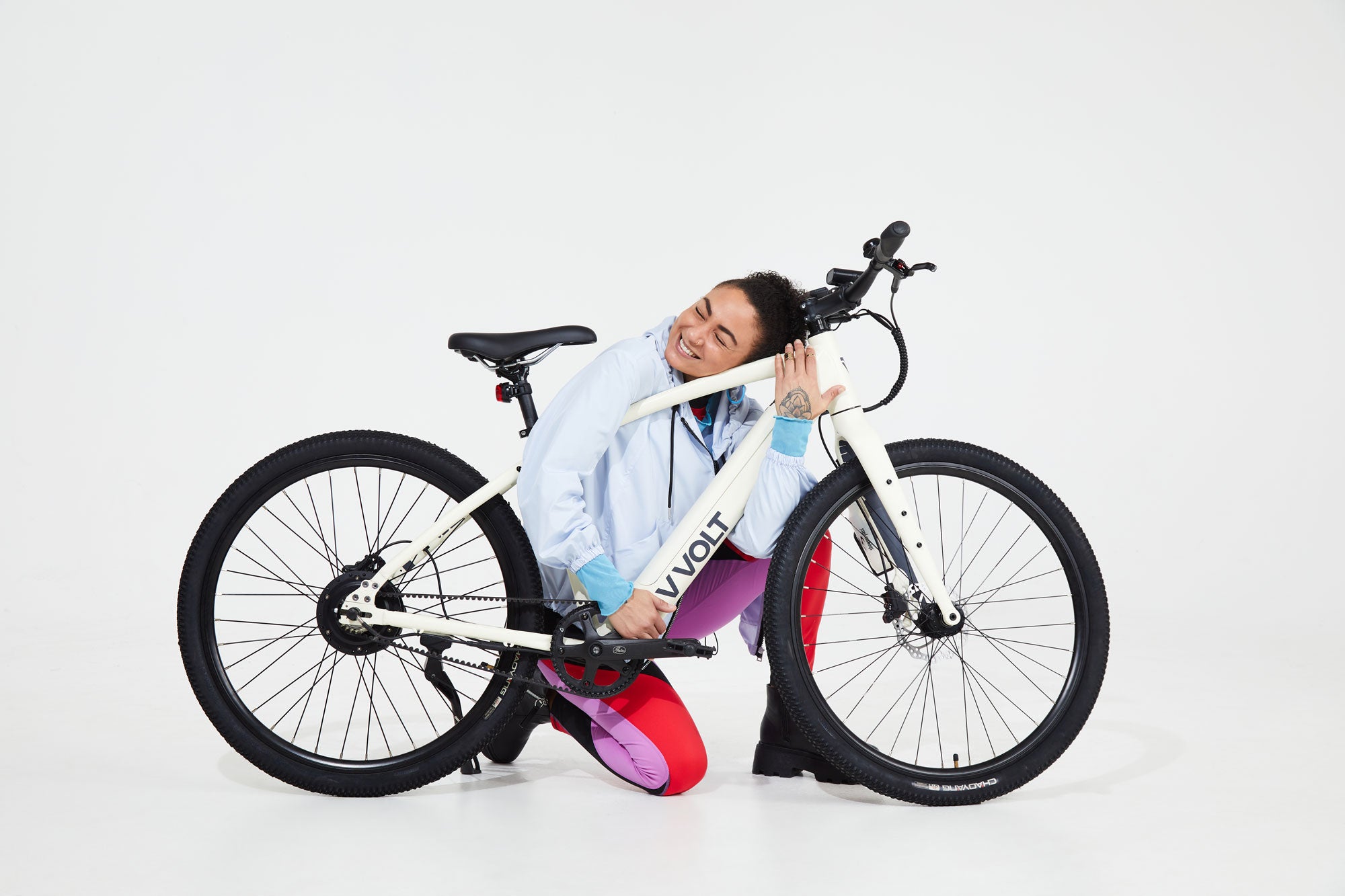 Woman hugging Vvolt electric bicycle